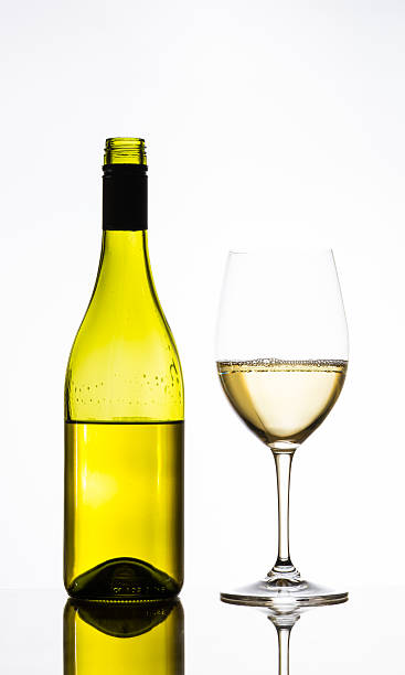 istock wine glass and bottle of white wine 495540062