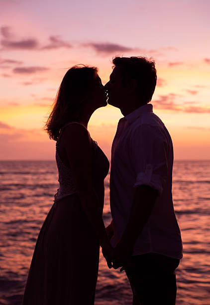 istock Couple kissing at sunset 495540513