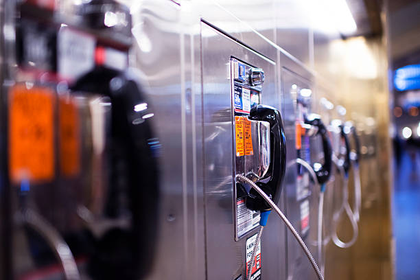 Public telephone in New York Public telephone in New York blue pay phone stock pictures, royalty-free photos & images