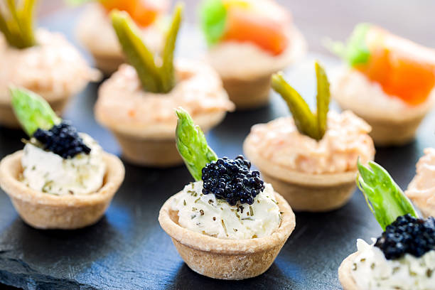 istock Multiple mini puff pastry tartlets with savory filling. 495541814