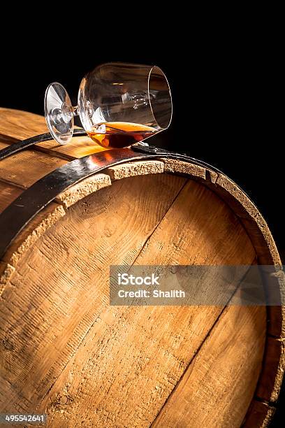 Glass Of Cognac On The Old Wooden Barrel Stock Photo - Download Image Now - Whiskey, Barrel, Scotland