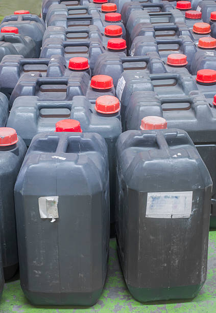istock used black plastic gallon Contain Liquor for machanic industry 495543301