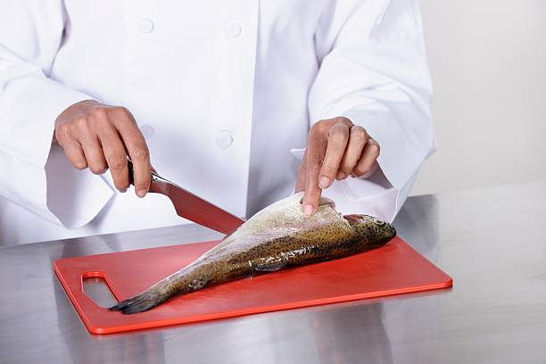 Caucasian Chef Peparing Fish