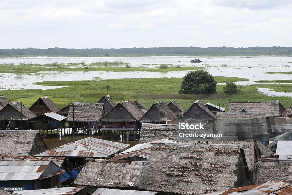 Homes in Belen - Peru Houses on stilts rise above the polluted water in Belen, Iquitos, Peru. Thousands of people live here in extreme poverty without clean water or sanitation. Amazon Region Stock Photo