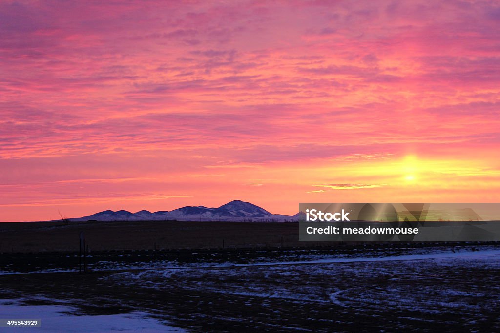 Sweetgrass Hills, Southern Alberta at Winter Sunrise Facing east to see the sunrise behind the Sweetgrass Hills in Southern Alberta near the Montana border in December.   Milk River Stock Photo