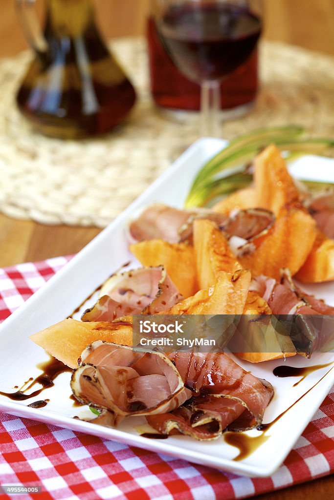 melon and ham melon with prosciutto ham with balsamico Appetizer Stock Photo