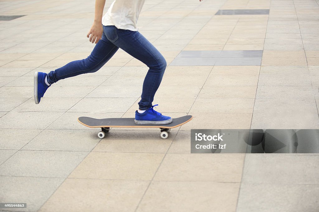 speeding skateboarding woman speeding skateboarding  woman at city Activity Stock Photo