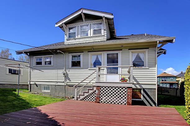 istock Small grey old charming house back yard exterior. 495547243