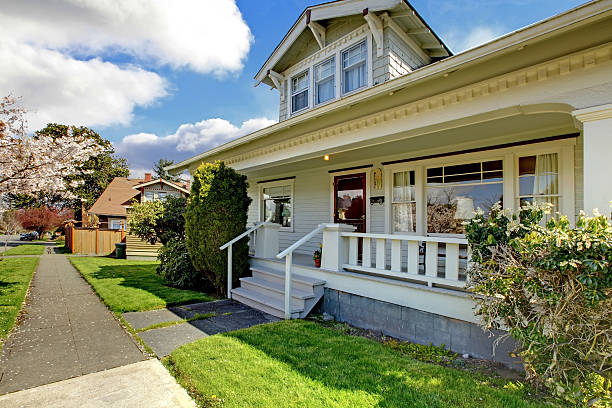 istock Little old cute house with a blooming cherry tree. 495547275