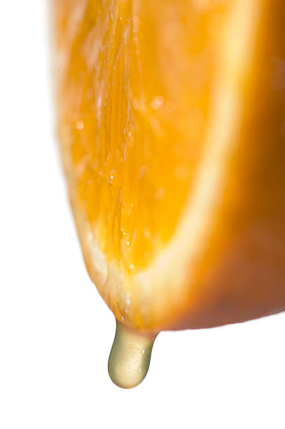 istock Slice of orange fruit with juice, isolated on white 495556290