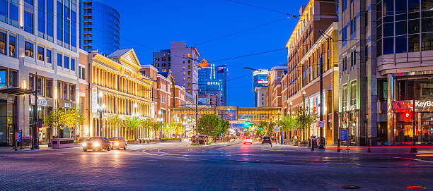 Main St stores banks illuminated Salt Lake City Utah USA Deep blue desert dusk skies over the street lights, traffic, tram lines, illuminated store fronts and businesses of Main Street, Salt Lake City, Utah. ProPhoto RGB profile for maximum color fidelity and gamut. small town america photos stock pictures, royalty-free photos & images