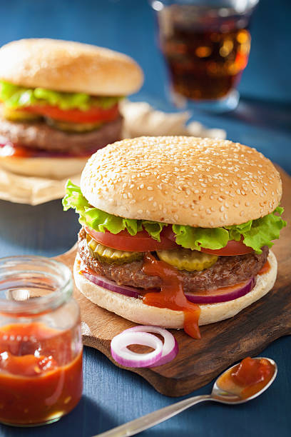 istock burger with beef patty lettuce onion tomato ketchup 495559976