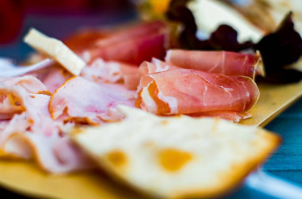 istock Antipasto board with prosciutto and other goodies 495560106