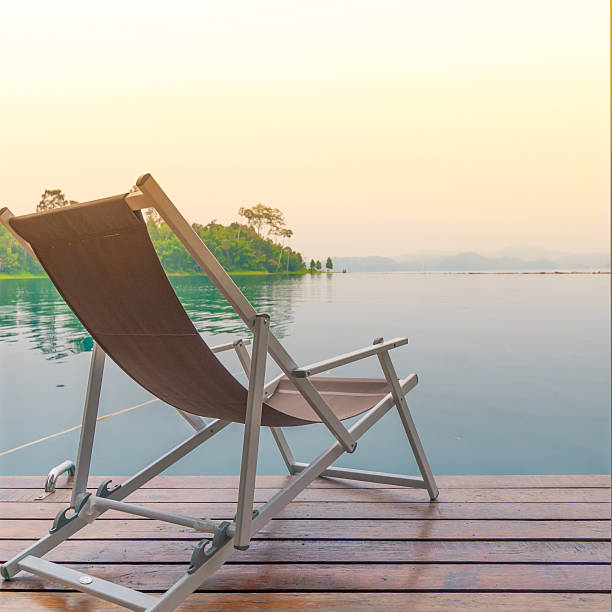 istock Beach chairs on perfect tropical lake 495560366