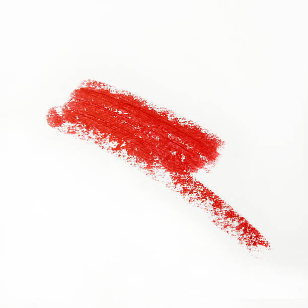 violento lápiz labial rojo sobre fondo blanco - lip liner fotografías e imágenes de stock