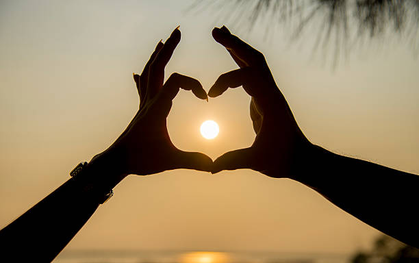 istock The sun on hand of couple 495564687