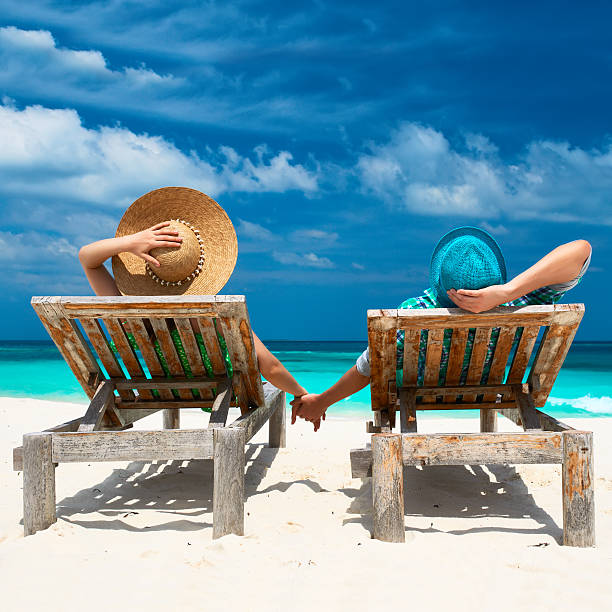 istock Couple in green on a beach at Maldives 495565109