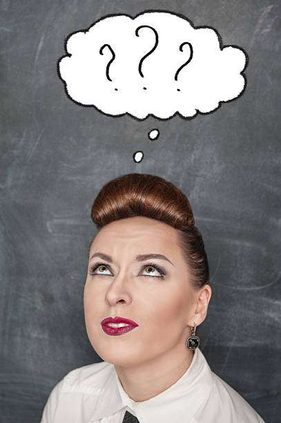 istock Doubting woman looking up above 495566107