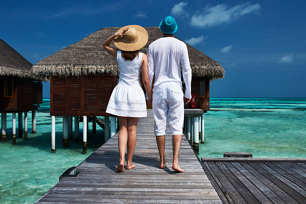 istock Couple on a beach jetty at Maldives 495566151