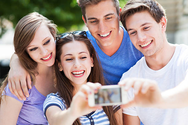 istock Friends taking photo outside 495566609