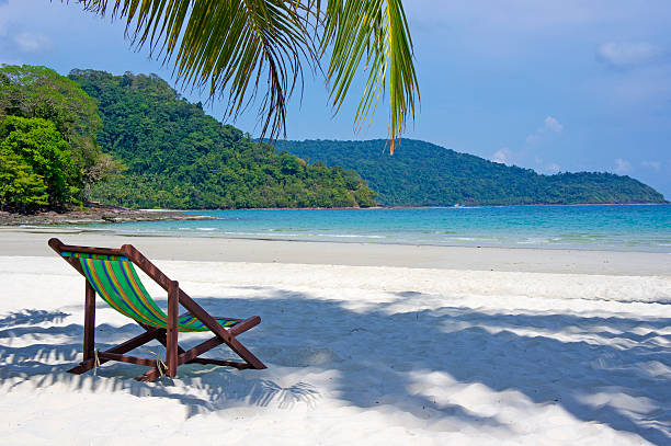 istock Tropical beach. Beach chairs on the white sand beach 495566667