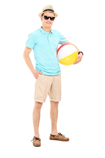 istock Young man holding a beach ball 495566713