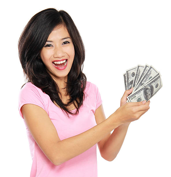 istock woman showing money isolated on white background 495568581