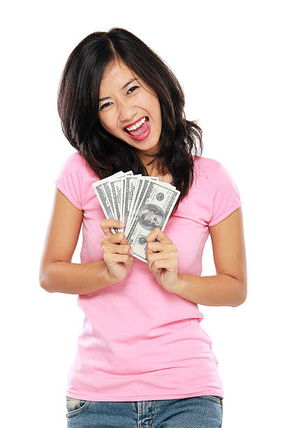 istock woman showing money isolated on white background 495568657