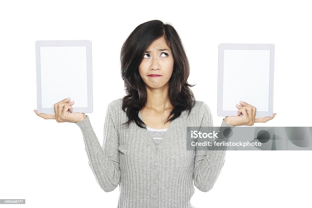 Woman showing two blank tablet computer screen Woman showing two blank tablet computer screen. isolated over white background Adult Stock Photo