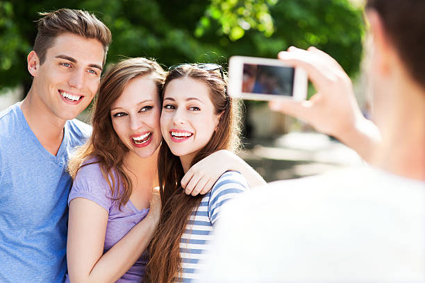 istock Friends taking photo outside 495568833