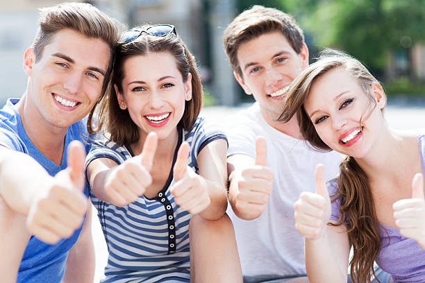 istock Young people with thumbs up 495569171