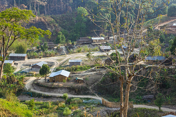 tribe village - laos hut southeast asia shack стоковые фото и изображения