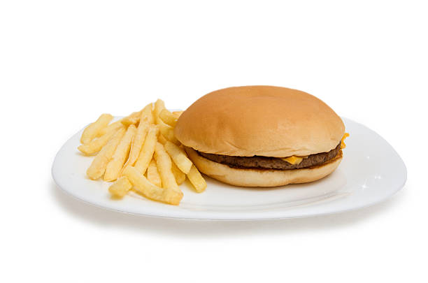 istock Cheeseburger on dinner plate with french fries isolated on white 495571199
