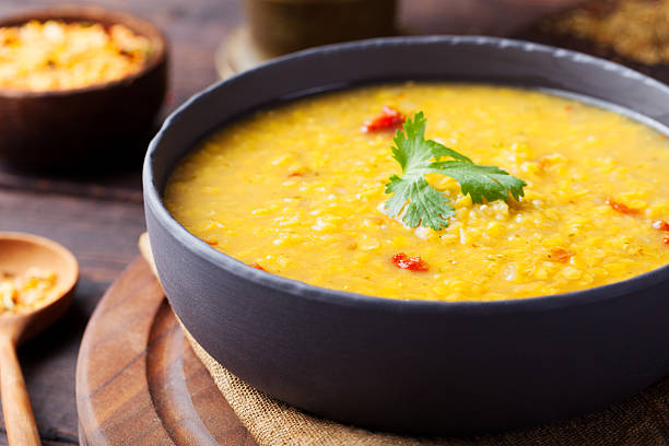 istock Red lentil Indian soup with flat bread. Masoor dal. 495574694