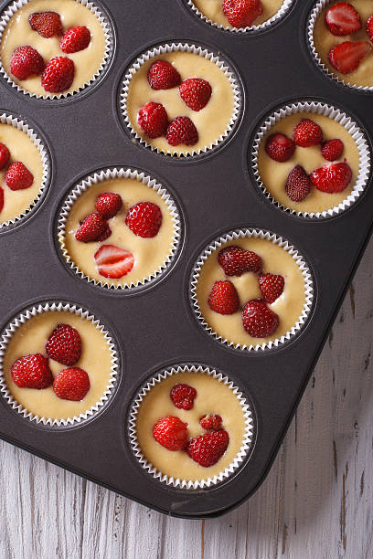istock cooking delicious strawberry muffins in baking dish macro 495578562