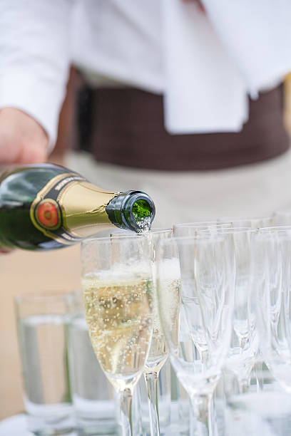 istock waiter pours champagne  bubbles 495579674