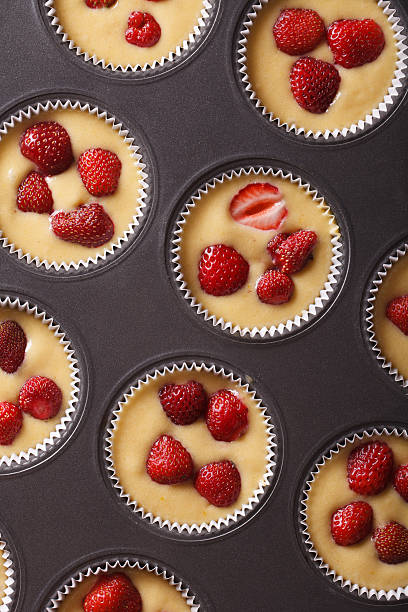 istock raw strawberry muffins in baking dish vertical top view 495579776