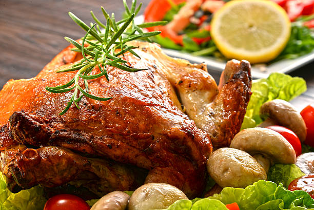 istock Roasted chicken with tomatoes and mushrooms 495579950