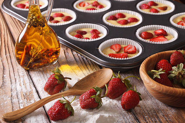 istock cooking berry muffins with fresh strawberries 495580738