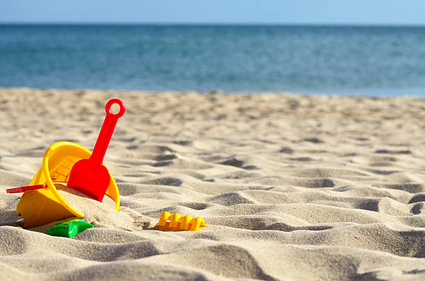 Toys sea sand Sandbox toys at the beach under blue sky sandbox stock pictures, royalty-free photos & images