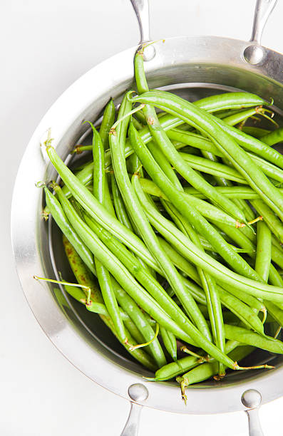 istock green beans in a saucepan on white 495586275