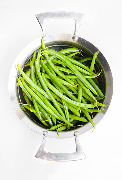 istock green beans in a saucepan on white 495586277