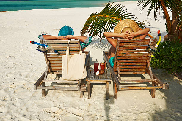 istock Couple in green on a beach at Maldives 495586731