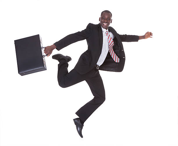 istock African Businessman Running Holding Briefcase 495588309