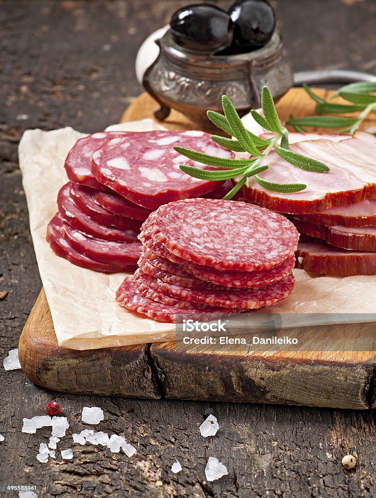 Assorted deli meats, rosemary and pepper Antipasto Stock Photo