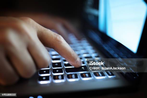 Hands Typing On Laptop Computer Stock Photo - Download Image Now - Computer Keyboard, Dark, Computer