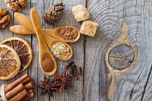 istock Selection of christmas spices on rustic wood background 495589810