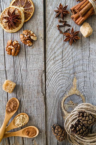 istock Selection of christmas spices on rustic wood background 495589854