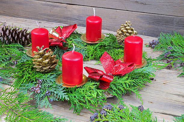 istock Advent wreath with candles on the wooden table 495590602