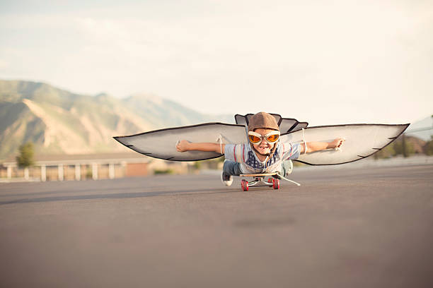 istock Young Boy with Wings Flies On Skateboard 495591744